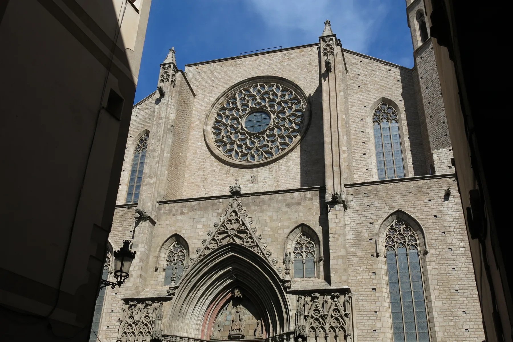 The Gothic west front of Santa Maria del Mar in Barcelona, with its round rose window and pointed doorway